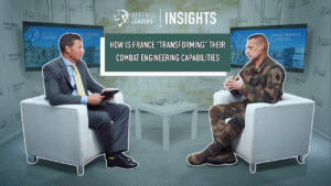 Two men in an interview setting; one in a suit, the other in military uniform. Text behind them reads, "How is France 'transforming' their combat engineering capabilities?