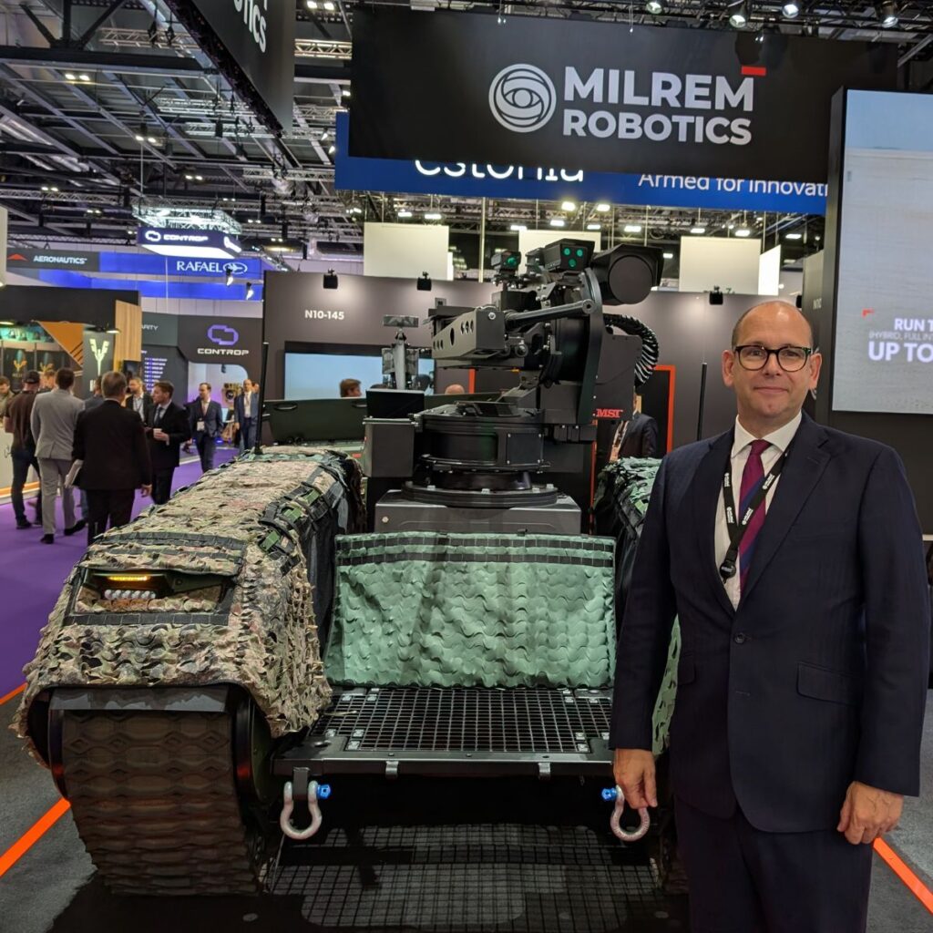 Director of Industrial Partnerships at Milrem Paul Clayton at DSEI in London alongside the Themis Combat Unmanned Ground Vehicle (UGV) with MSI-Defence Systems’ Terrahawk Remote Weapon Station (RWS) and Overwatch Aerospace’s Apex Uncrewed Aerial System (UAS).