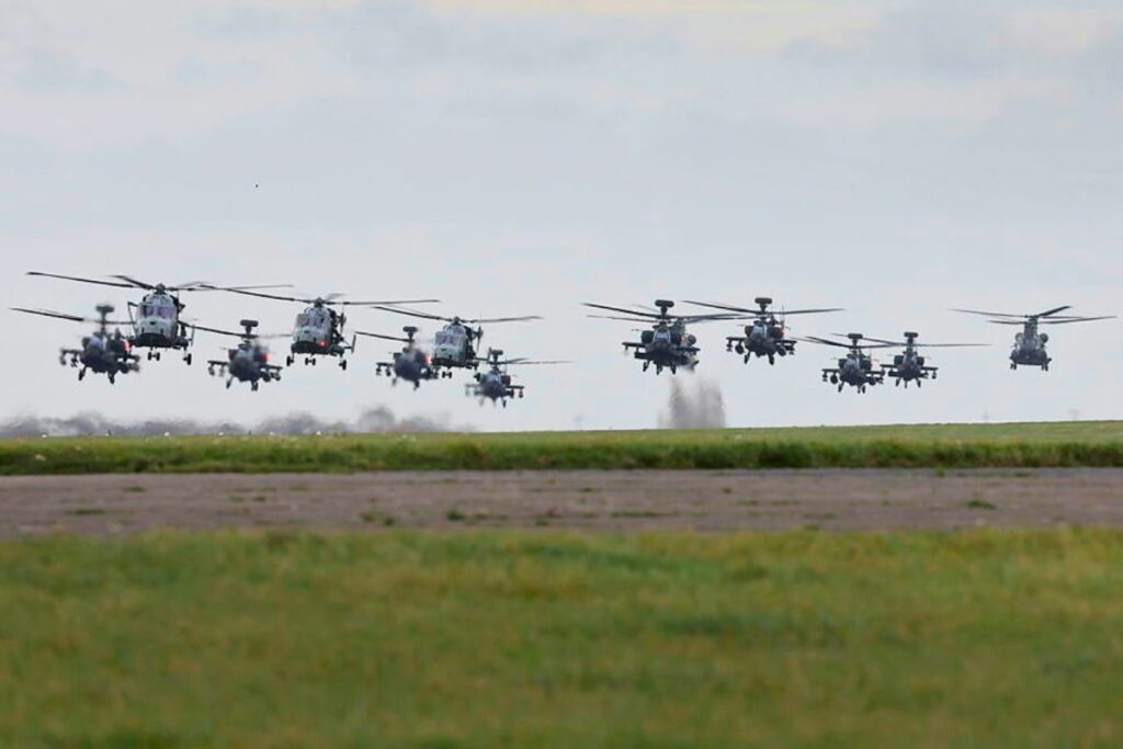 “Elephant walk” — a formation of 24 Apache, Chinook, Gazelle, and Wildcat helicopters lifted off from Wattisham Flying Station in Suffolk after taxiing together along the runway.