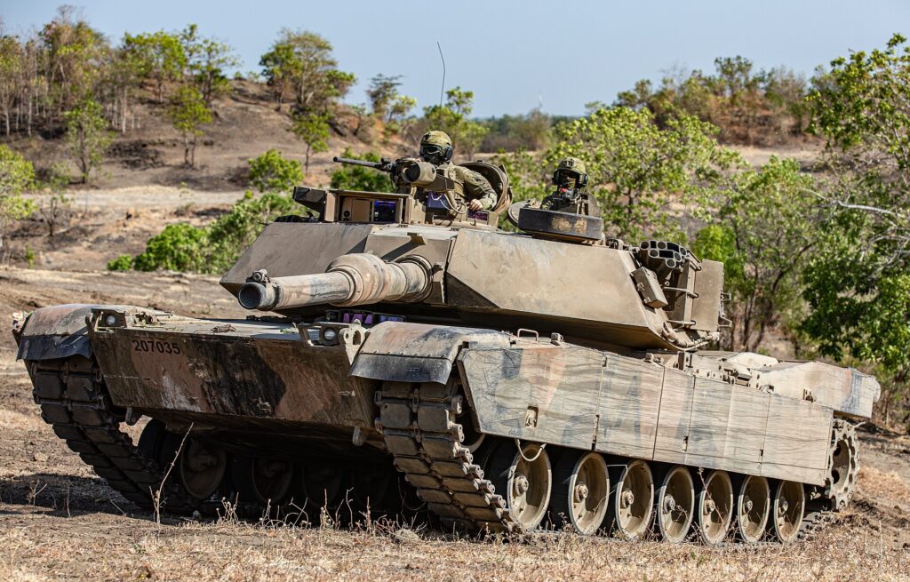 An Australian Defense Force (ADF) M1A1 Abrams tank maneuvers across the battlefield to engage the opposing force during Exercise Super Garuda Shield
